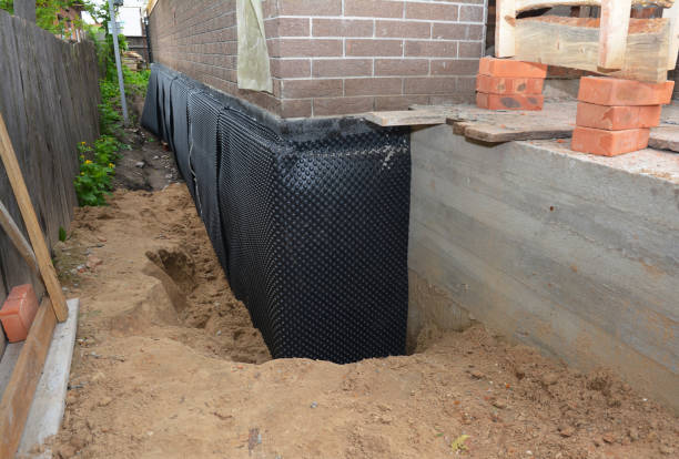 SJ Waterproofing Pros technician performing targeted Exterior Waterproofing assessment in Erie, PA